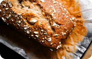Freshly baked banana bread with seeds and nuts