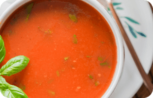 Minestrone soup recipe with fresh basil garnish