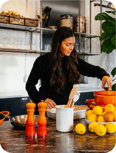 Woman preparing MG-friendly recipes in a kitchen