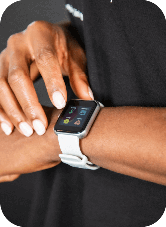Person adjusting smartwatch during strength and endurance training for Myasthenia Gravis